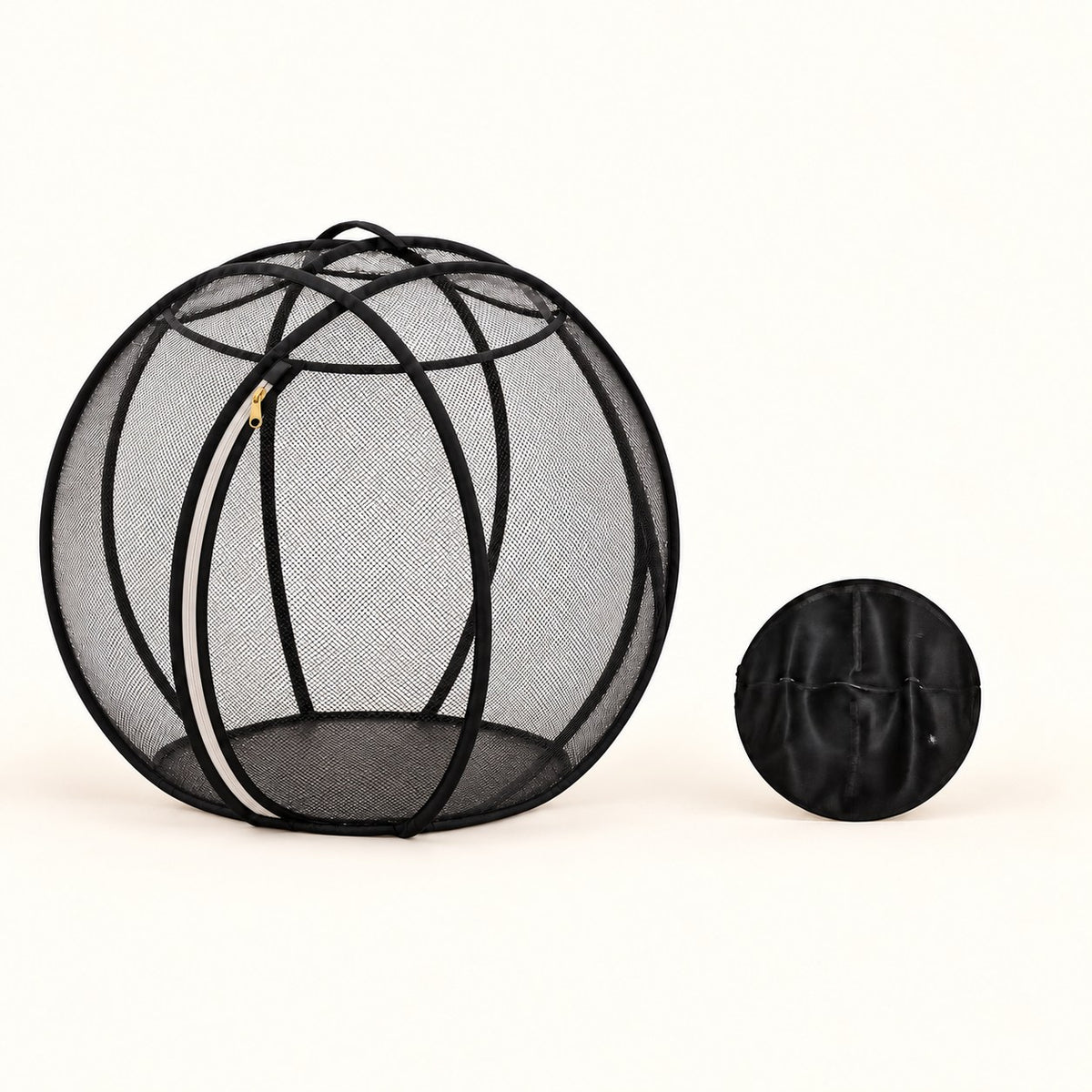 Open black mesh bubble playpen beside its compact folded disc, showing the approximate 70 cm and 30 cm diameters. AI-generated product image.